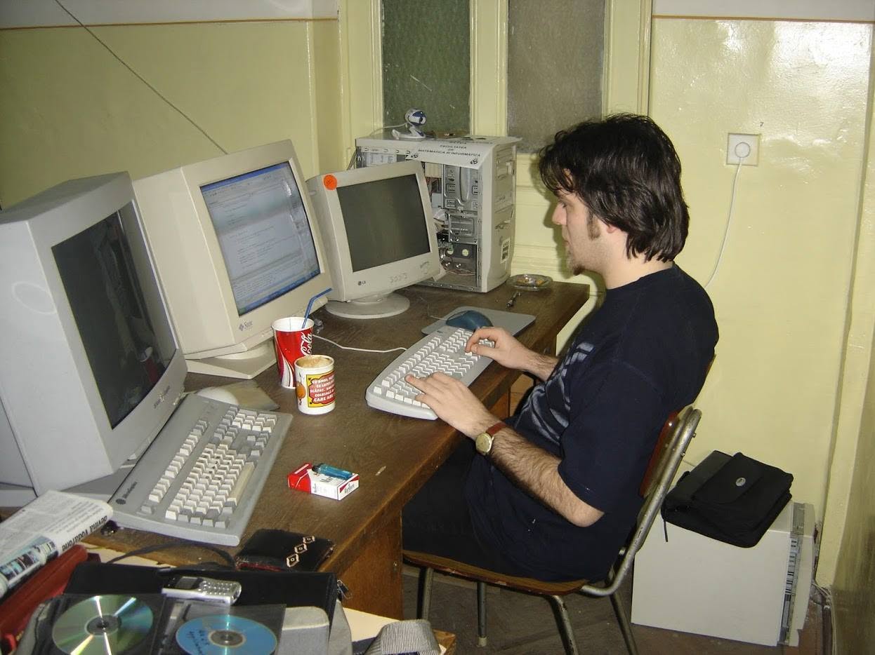 My university desk: two monitors before it was cool, and a SGI workstation.